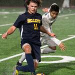 Bellevue junior Carson Wachter, left, carries the ball upfield while being chased by Interlake senior Cameron Rao in a matchup between 3A KingCo soccer rivals on April 10 in Bellevue. Wachter scored one goal in Bellevues 4-0 victory. Photo courtesy of Stephanie Ault-Justus