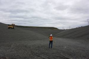 Scott Barden stands at the bottom of the massive pit of the landfills newly-built eighth section. Work on the new section has been underway for around two years. Aaron Kunkler/staff photo
