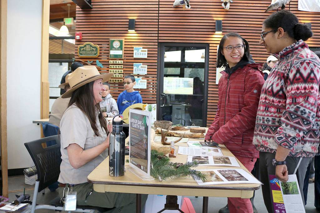 Families learned ways to help protect the environment through a variety of eco-stations at the Lewis Creek Park Visitors Center on April 20. Stephanie Quiroz/staff photo