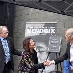 USPS district manager Darrell Stoke, Janie Hendrix and Congressman Adam Smith (D-WA) unveil the plaque honorarily naming the Renton Highlands Post Office as the James Marshall Jimi Hendrix Post Office on Friday, April 19. Photo by Haley Ausbun