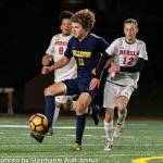 Bellevue Wolverines junior midfielder Carson Wachter, middle, controls possession of the ball while being defended by Juanita players Andrew Taylor (right) and Victor Ramos Agular (left). Photo courtesy of Stephanie Ault Justus