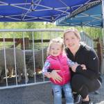 Stephanie Quiroz/staff photo                                 Claire Cannon and daughter Riley, 2, pose for a photo while enjoying the sheep at the annual sheep shearing event at Kelsey Creek Farm on April 27.