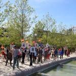 The group marched around Downtown Park before returning to center for a moment of silence. Evan Pappas/Staff Photo