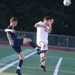 Interlake senior Evan Gueye-oue, left, knocks the ball past Juanita junior Aidan Geurts on May 9. Andy Nystrom / staff photo