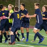 Bellevue Wolverines players mob goalie Jackson Buck after he stopped Peninsulas Evan Daytons penalty shot during the overtime shootout. Bucks save clinched a Wolverines 2-1 victory. Photo courtesy of Stephanie Ault Justus