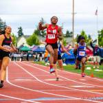 Sammamish Totems sprinter Antoinette Stubbfield (No. 3) leaps into the air after crossing the finish line in first place in the 100 at the 2A state track meet on May 25 at Mount Tahoma High School in Tacoma. Photo courtesy of Don Borin/Stop Action Photography