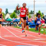 Sammamish Totems sprinter Antoinette Stubbfield (No. 3) leaps into the air after crossing the finish line in first place in the 100 at the 2A state track meet on May 25 at Mount Tahoma High School in Tacoma. Photo courtesy of Don Borin/Stop Action Photography