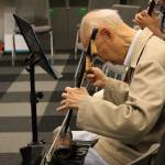 Madison Miller / staff photos                                Above, Binliang Wang practices the music for the upcoming production of Women in Times of War. Below, Mingzhu Jacobson, Binliang Wang, and Yabin Hu practice.