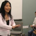 Madison Miller / staff photo                                Mingzhu Jacobson rehearses for the upcoming Women in Times of War production in a Microsoft Building 30 room with Yabin Hu.