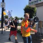 Grocery store union workers picket outside of a Renton Fred Meyers on July 31. They are in contract negotiations with Kroger for higher wages, predictable scheduling and better safety conditions. Aaron Kunkler/staff photo