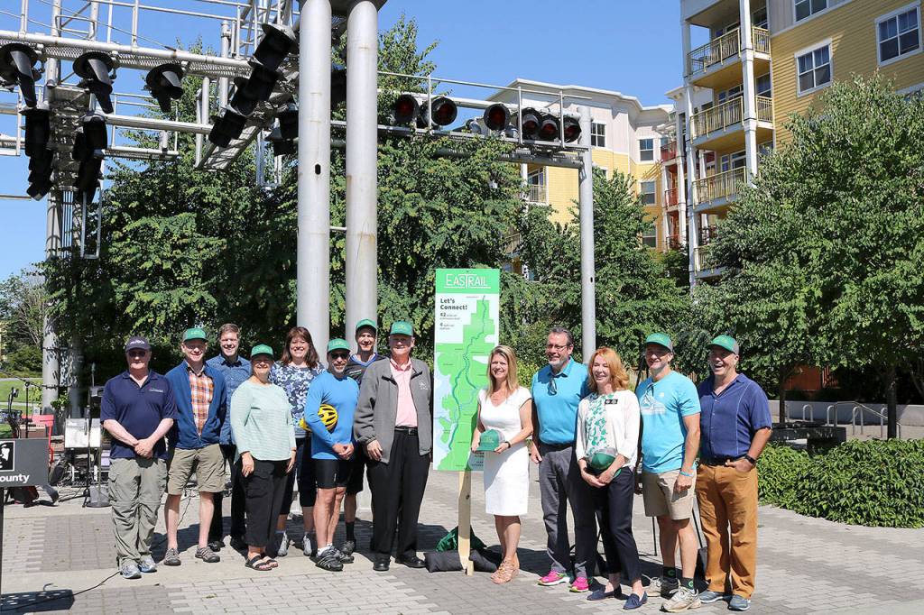 Stephanie Quiroz/staff photo                                Elected officials, and community leaders from Redmond, Kirkland, Bellevue and King County, and Eastrail Partners unveiled the new name for Eastside Rail on July 20.