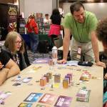 Madison Miller / staff photo                                Walter Lutsch, center, hosts Batman: Gotham City Under Siege at the 40th annual Dragonflight GameCon at the Bellevue Hilton hotel.