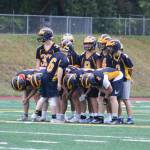 Bellevue players prepare to practice their run-heavy offense. Benjamin Olson/ staff photo