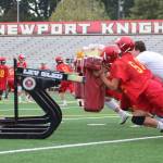 Newport linemen push a blocking sled at practice. Benjamin Olson/ staff photo