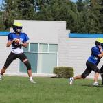 Sophomore quarterback Samuel Cornett throws a pass during practice. Benjamin Olson/ staff photo