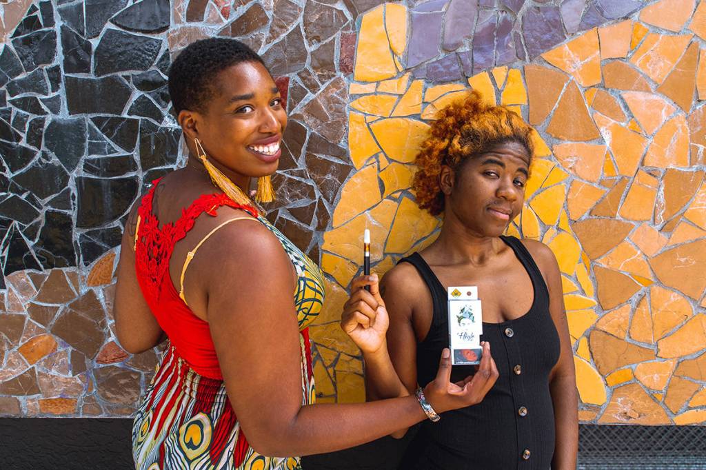 Heylo Cannabis education and outreach manager Alfa Lashay, left, joins Seattle-based recording artist and producer SassyBlack for a promotional shoot highlighting Heylos new cannabis oil product, Ancient Mahogany Gold, named for SassyBlacks new album. Both are due for release this week.