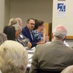 Staff photo/Blake Peterson                                Paul Cornish (center), the project director of the Bus Rapid Transit program, spoke on behalf of Sound Transit at the Sept. 10 meeting.