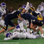 Bellevue running back Joby Schneider falls forward during the 28-27 Wolverine victory over Garfield on Sept. 20. Photo courtesy of Stephanie Ault Justus