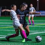 Bellevue midfielder Hinana Takashima (left) and Sammamish forward Ava Rochlin (right) reach for the ball during a 2-1 Bellevue win on Oct. 3. Photo courtesy of Stephanie Ault Justus