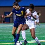 Bellevue forward Rebekah Roth (8) and Lake Washington defender Ari Issa (19) fight for the ball in the Wolverines 2-0 loss on Oct. 15. Photo courtesy of Stephanie Ault Justus