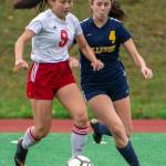 Newport freshman Maggie Ma (9) and Bellevue junior Audrey Miller (4) both go for the ball during a 4-0 Bellevue win on Oct. 19. Photo courtesy of Stephanie Ault Justus