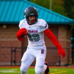Sammamish senior running back Benjamin Cook carries the ball during a game earlier in the season against Cleveland on Sept. 28. Photo courtesy of Charlie Peters