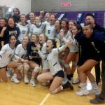The Bellevue volleyball team celebrates with the 3A KingCo tournament trophy on Nov. 7. Benjamin Olson/staff photo