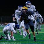 Bellevue running back Cade Jochums runs for a 32-yard touchdown in the Wolverines 57-21 victory over Meadowdale on Nov. 15. Photo courtesy of Stephanie Ault Justus
