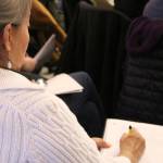 Parents take notes during the SOS program presentation for parents on Nov. 7. Madison Miller / staff photo