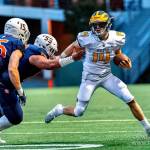 Bellevue running back Alex Reid (14) tries to avoid tacklers during a 3A state quarterfinal on Nov. 23. Photo courtesy of Patrick Krohn/Patrick Krohn Photography