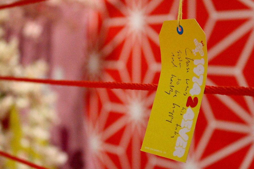 Tour visitors write wishes for the upcoming year at the Hello Kitty Friends Around the World Tour on Dec. 7. Madison Miller/staff photo