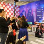 Madison Miller/staff photo                                Guests pop party poppers to celebrate Hello Kittys 45th anniversary in a mock New York City.