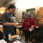 From left, James Yang and Maria Lanz discuss holiday treats during the last Talk Time class before Christmas at Aljoya Mercer Island. Samantha Pak/staff photo