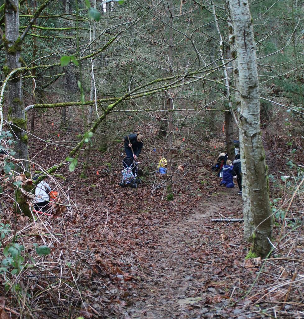 Volunteers dig away at Wilburton Hill Park. Andy Nystrom/ staff photo