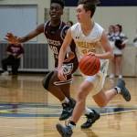 Bellevues Oliver Thomas (right) tries to run past Mercer Island guard Nigel Seda (right) during their game on Jan. 15. Photo courtesy of Stephanie Ault Justus