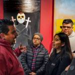 Photo courtesy of Centro Cultural Mexicano                                Claudio Pérez speaks with a group of students at the opening reception for the Border Doors exhibit at Centro Cultural Mexicano.