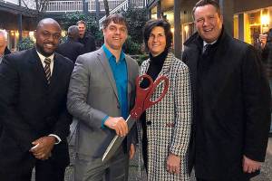 Bellevue councilmember Jeremy Barksdale, CFH executive director David Bowling, Mayor Lynne Robinson and Deputy Mayor Jared Nieuwenhuis celebrate the opening of CFHs permanent year-round mens shelter on Jan. 13. Courtesy photo