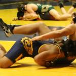Bellevue 220-pound freshman Kolani Masunu (left) takes down Interlakes Cole Mullenix during a meet on Jan. 30. Mullenix won the match by fall. Benjamin Olson/staff photo