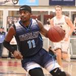 Interlake guard Ibra Ibrahim scored eight points for the Saints in their 61-36 loss to Mercer Island on Feb. 11 at Sammamish High School. Benjamin Olson/staff photo