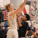 Bellevues Hans Stone makes a 3-pointer with 1:03 left in the game to help the Wolverines secure a 48-40 win over Lake Washington on Feb. 11 at Sammamish High School. Benjamin Olson/staff photo