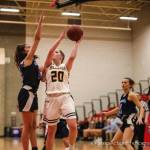 Bellevue junior Sophia Friend is defended by Interlakes Mia Robertson during a 3A KingCo loser-out game on Feb. 11. Photo courtesy of Don Borin/Stop Action Photography