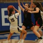Newport players defend against Inglemoors Isabella Reed during a 4A Wes-King District Tournament game on Feb. 15. Andy Nystrom/ staff photo
