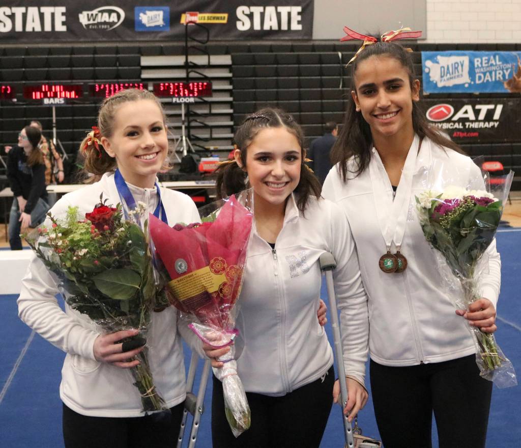 Newport gymnasts (From left) Anna Bencke, Maddy Thompson and Bella Nilsen competed at the 4A state gymnastics meet on Feb. 21-22 at Sammamish High School. Benjamin Olson/staff photo
