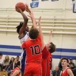 Bellevue Christian senior forward Joseph Primas (left) takes a shot during the Vikings 58-43 loss to Seattle Christian back on Jan. 17. Benjamin Olson/staff photo