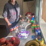 Bellevue School District (BSD) staffer Lori Schrader Hanson assisting food-service efforts Monday, March 16. Photo courtesy BSD