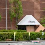 While protesters and police were a few yards away, people moved in and out of the Bellevue Square Mall with arms full of clothes shoes and other merchandise on Sunday, May 31. Photo by Haley Ausbun/Sound Publishing