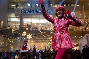 The sidewalks between Bellevue Square and Lincoln Square were packed with people who came to catch the nightly Snowflake Lane on Dec. 10. The parade, which begins nightly at 7 p.m., celebrates 15 years in the community and features 300 performers, holiday characters and lights. Ashley Hiruko/staff photo