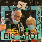 Jay and Beck Enoch celebrating vaccination (photo credit: Aegis Living Bellevue)