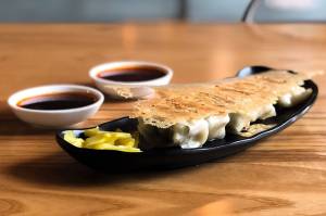 Pan-fried wontons with chili and spicy garlic sauces (photo credit: Dough Zone Dumpling House)