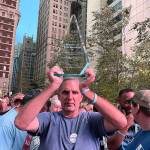 Michael Brian Protzman holds a trophy on Nov. 1. Photo via Protzmans Negative48 Telegram channel